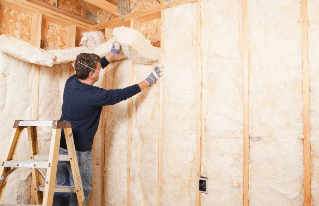 Participants learning energy-efficient cavity wall insulation methods.